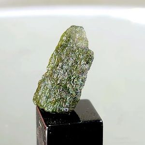 Moldavite .9g/4.5 carats Natural. COA included and stand. Beautiful Green Color.